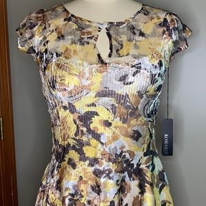 NWT Cap sleeve Komarov  dress size large, but very form fitting. 100% polyester.